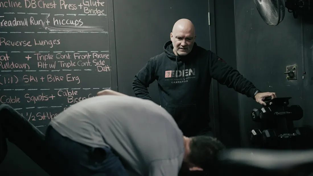 Mick Mackell coaching a member at The Den