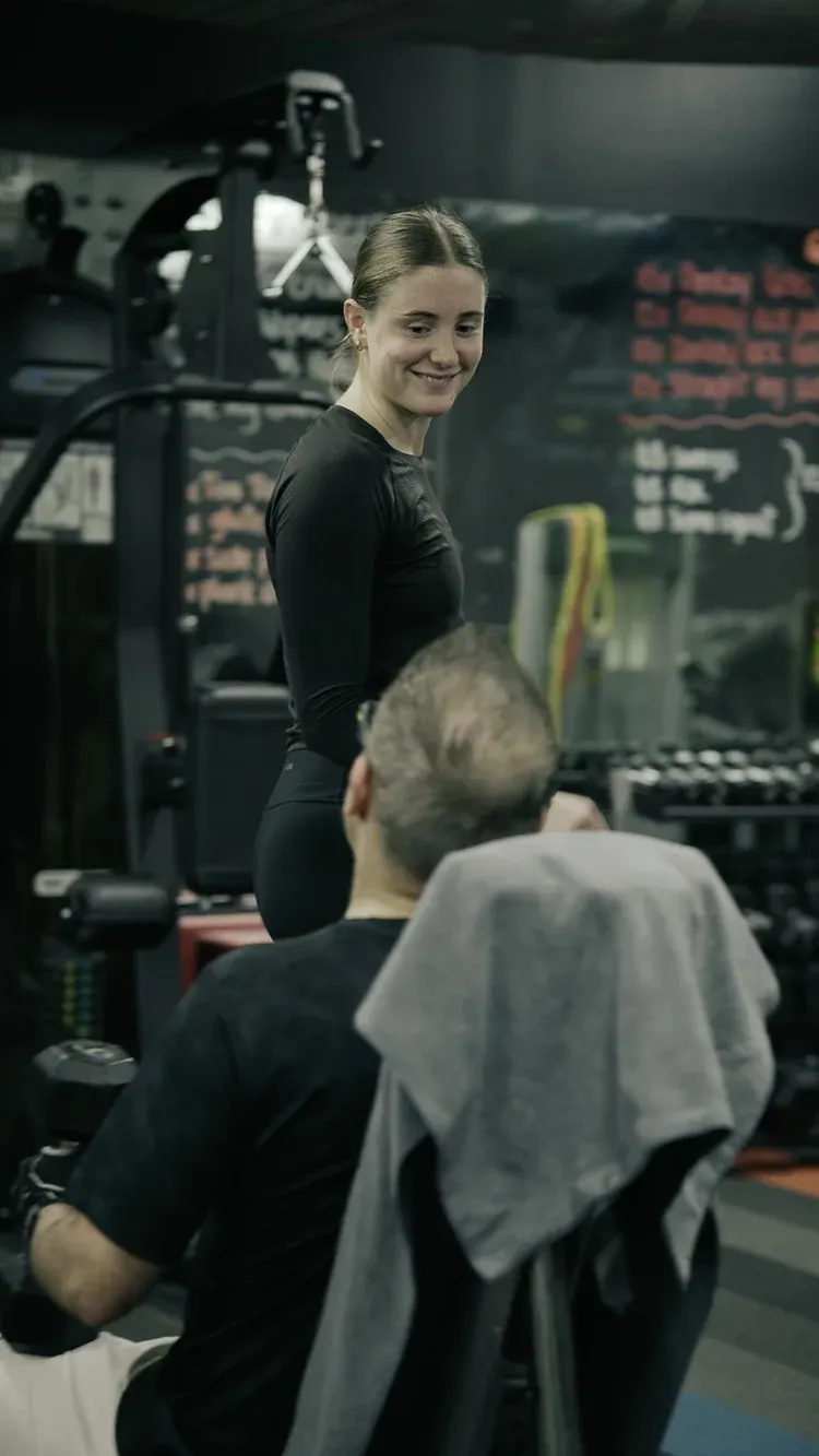 Maddie coaching a member at The Den