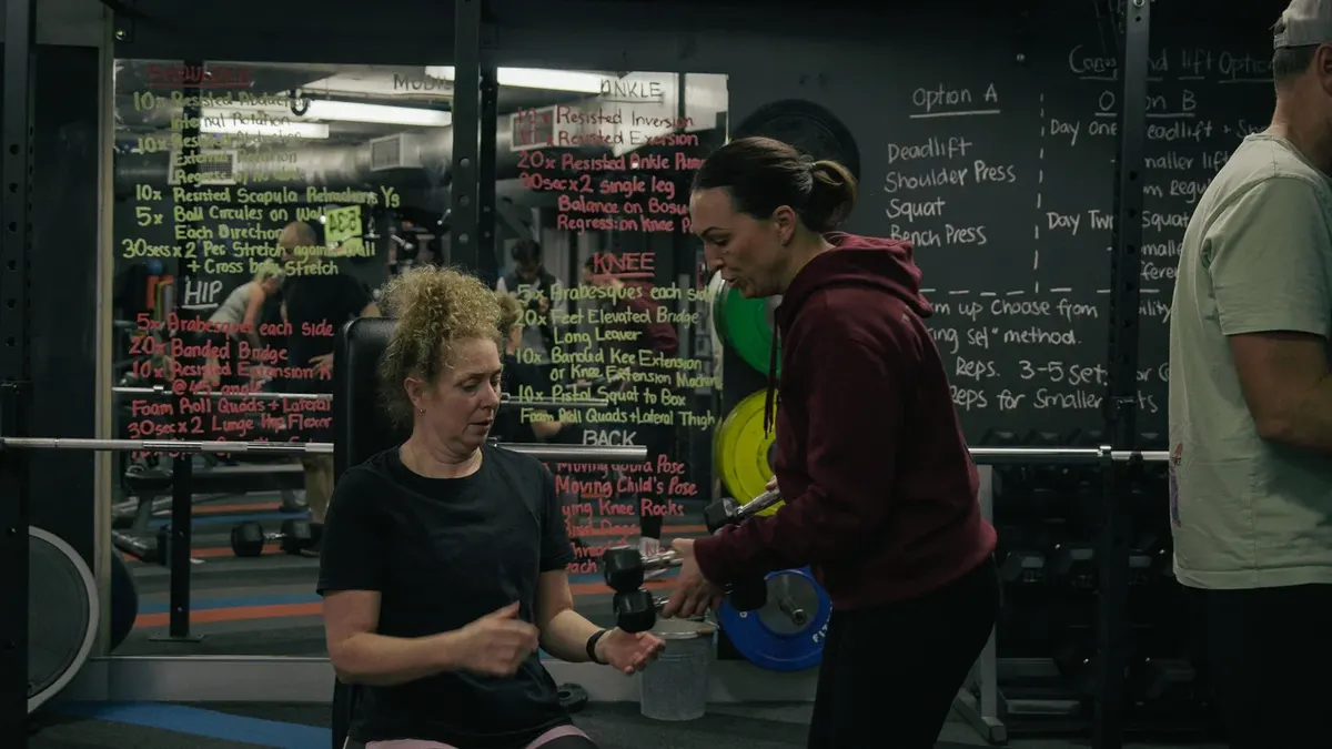 Nicole Wellington working one-on-one with a member