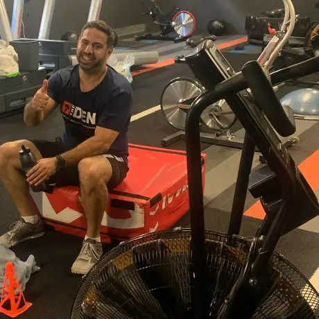Training at The Den: assault bike
